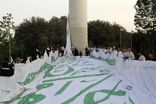 بزرگترین پرچم علوی در تهران همزمان با ۱۱۰ نقطه در جهان به اهتزاز درآمد